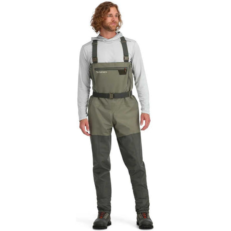Man wearing green waders on a white background