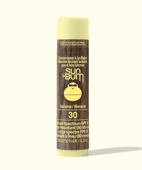 Sun Bum sunscreen lip balm tube with banana flavor on a white background