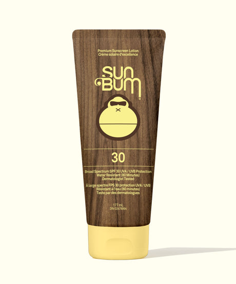 Sun Bum sunscreen lotion tube with brown and yellow design on a white background