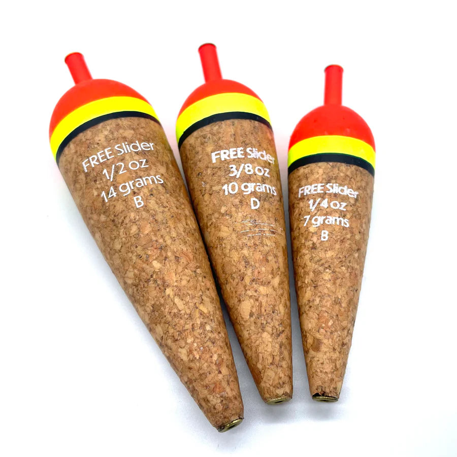 Three fishing floats with cork bodies and colorful tops on a white background