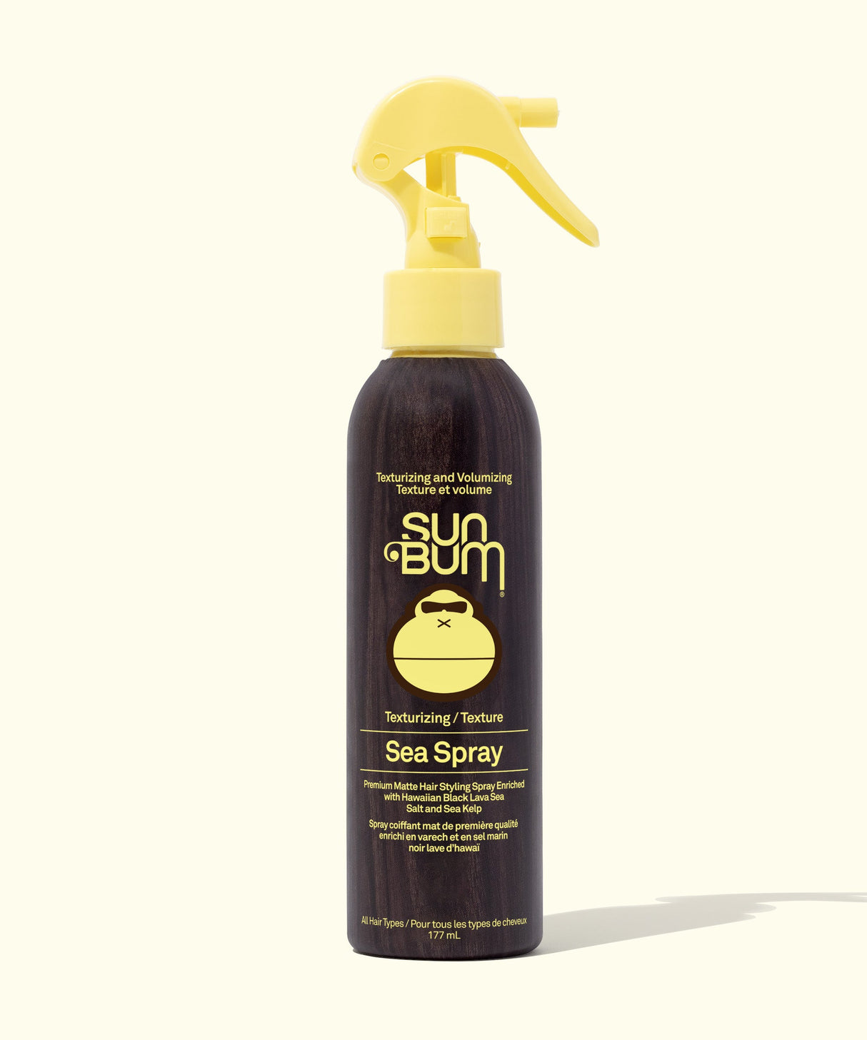 Sun Bum Sea Spray bottle with yellow nozzle on a white background