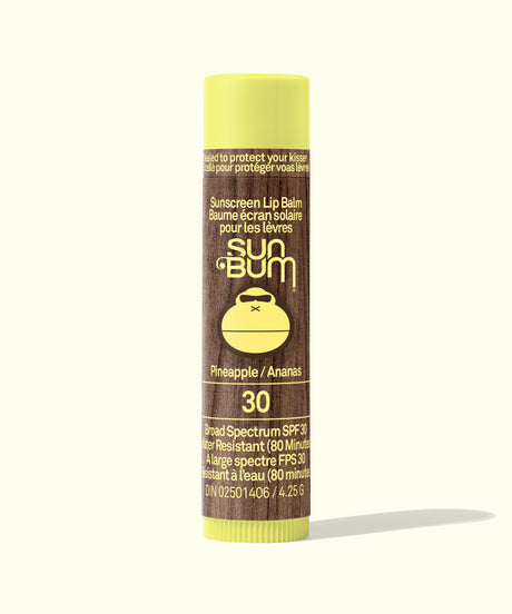 Sun Bum sunscreen lip balm tube with yellow cap on a white background