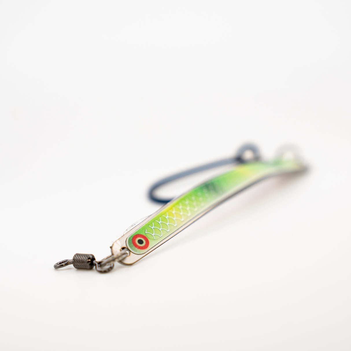 Fishing lure with a green and silver body on a white background