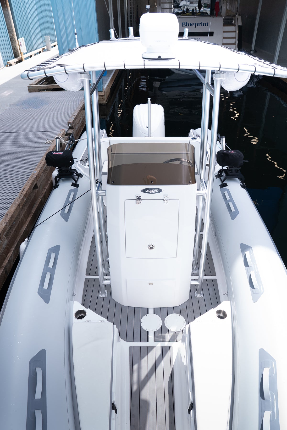 Overhead view looking aft over the T-top, centre console and grey deck of the AB Inflatables 21 Oceanus VST