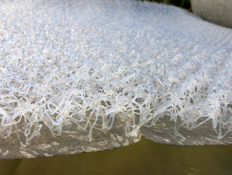 Close-up side profile of HyperVent mattress ventilation underlay showing the open-loop polymer structure that creates airflow beneath boat, RV, camper van, and cabin mattresses to reduce condensation.