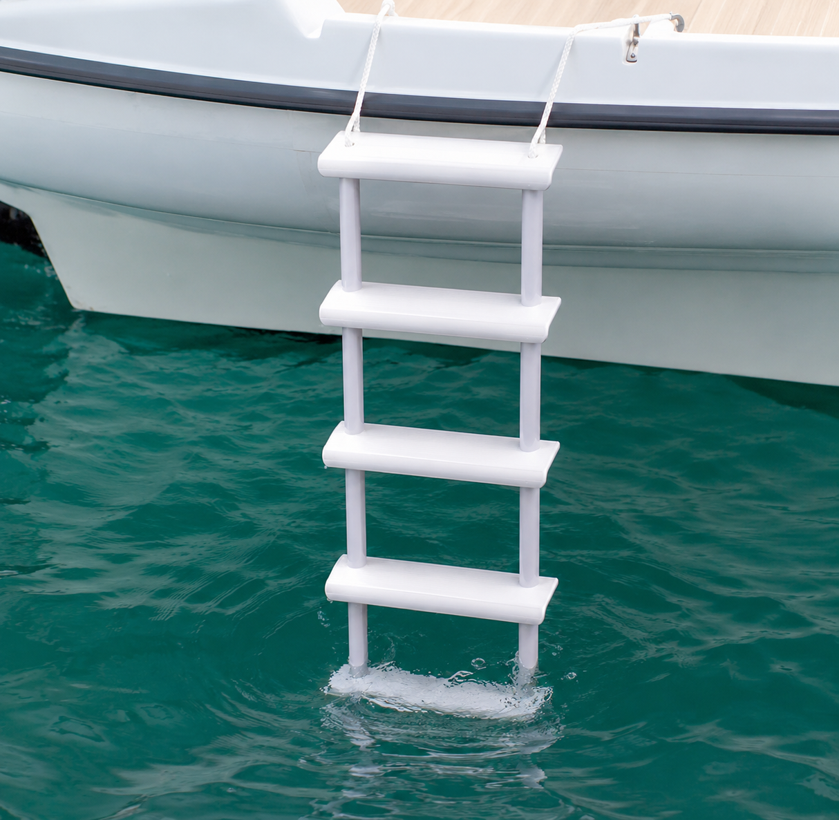 Invincible Marine 5 Step Folding Rope Ladder deployed over the side of a boat for safe and easy water reboarding.