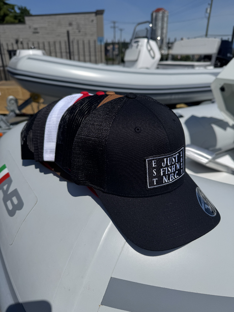 Black cap with text on a boat - Black
