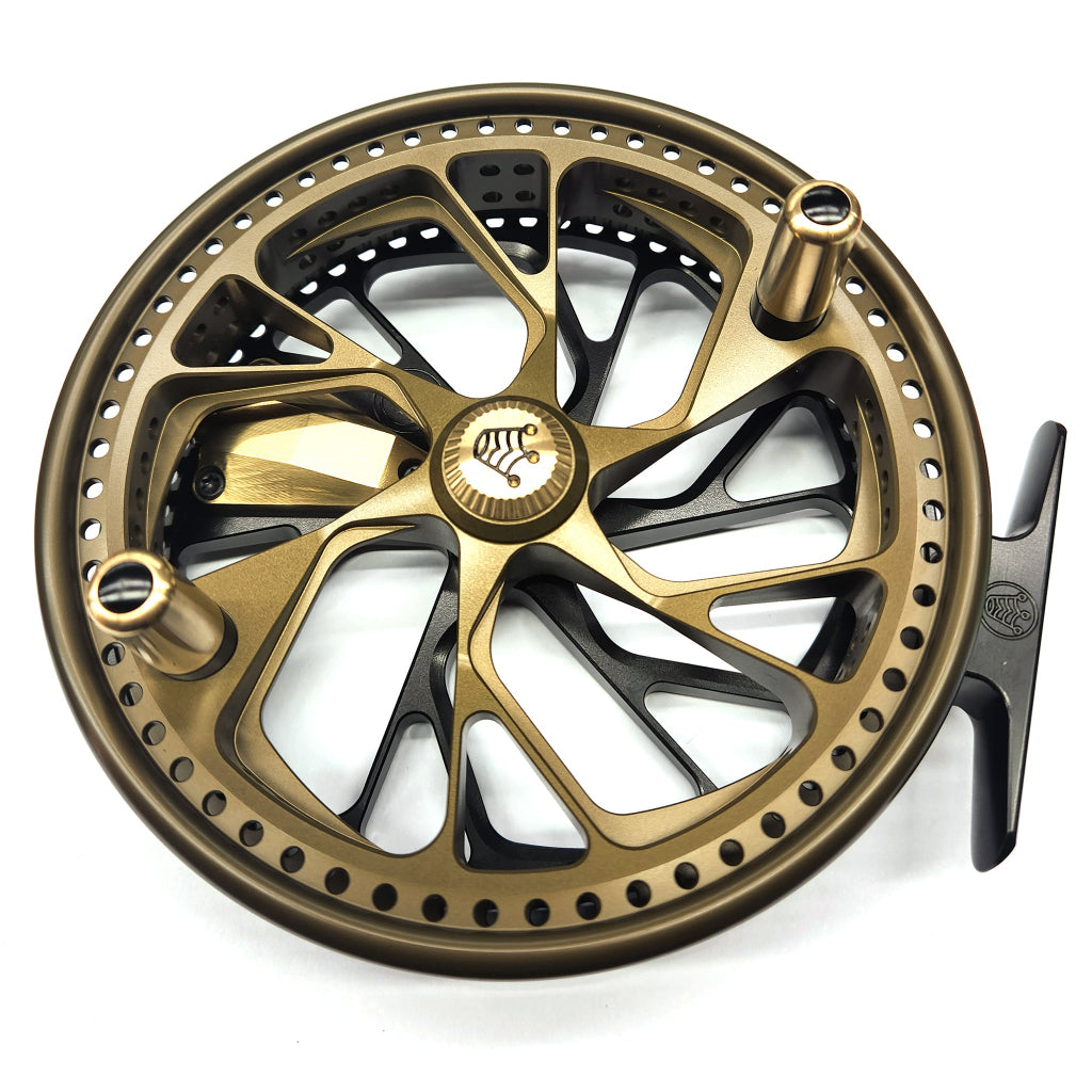Gold and black fishing reel on a white background Kingpin Zodiac 500 Centerpin Reel - Special Edition Black & Green/Gold