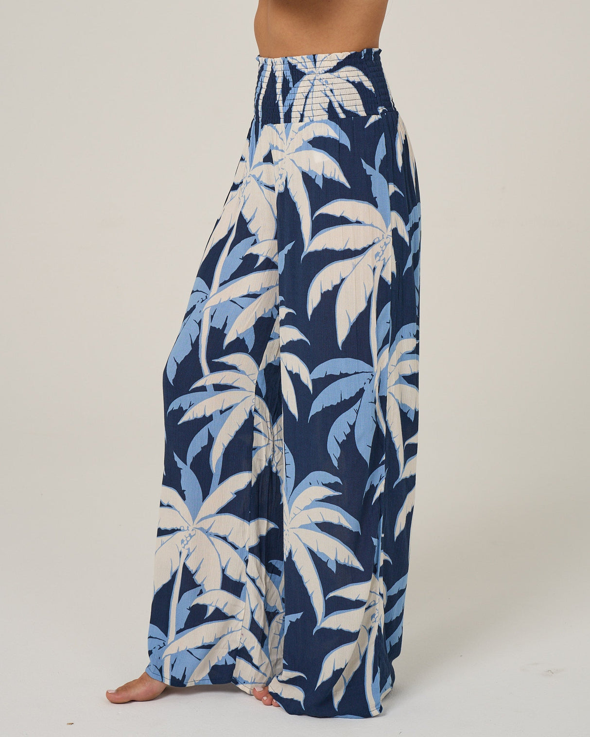 Profile view of the Palms Up Pant - Bright Navy. 