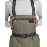 Green waders with 'Simms' branding on a white background