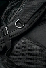 Close-up of a black backpack with straps and mesh details
