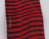 Red and black striped fabric on a white background