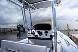 Centre console helm with steering wheel and windscreen under the T-top, seen from the seat