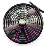 Fly fishing reel with black and pink design on a white background