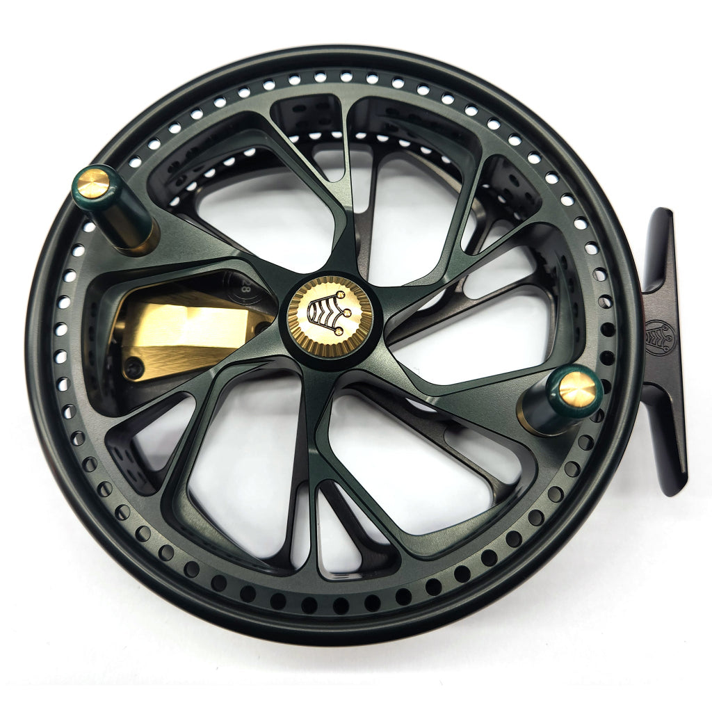 Black and gold fishing reel on a white background Kingpin Zodiac 500 Centerpin Reel - Special Edition Black & Green
